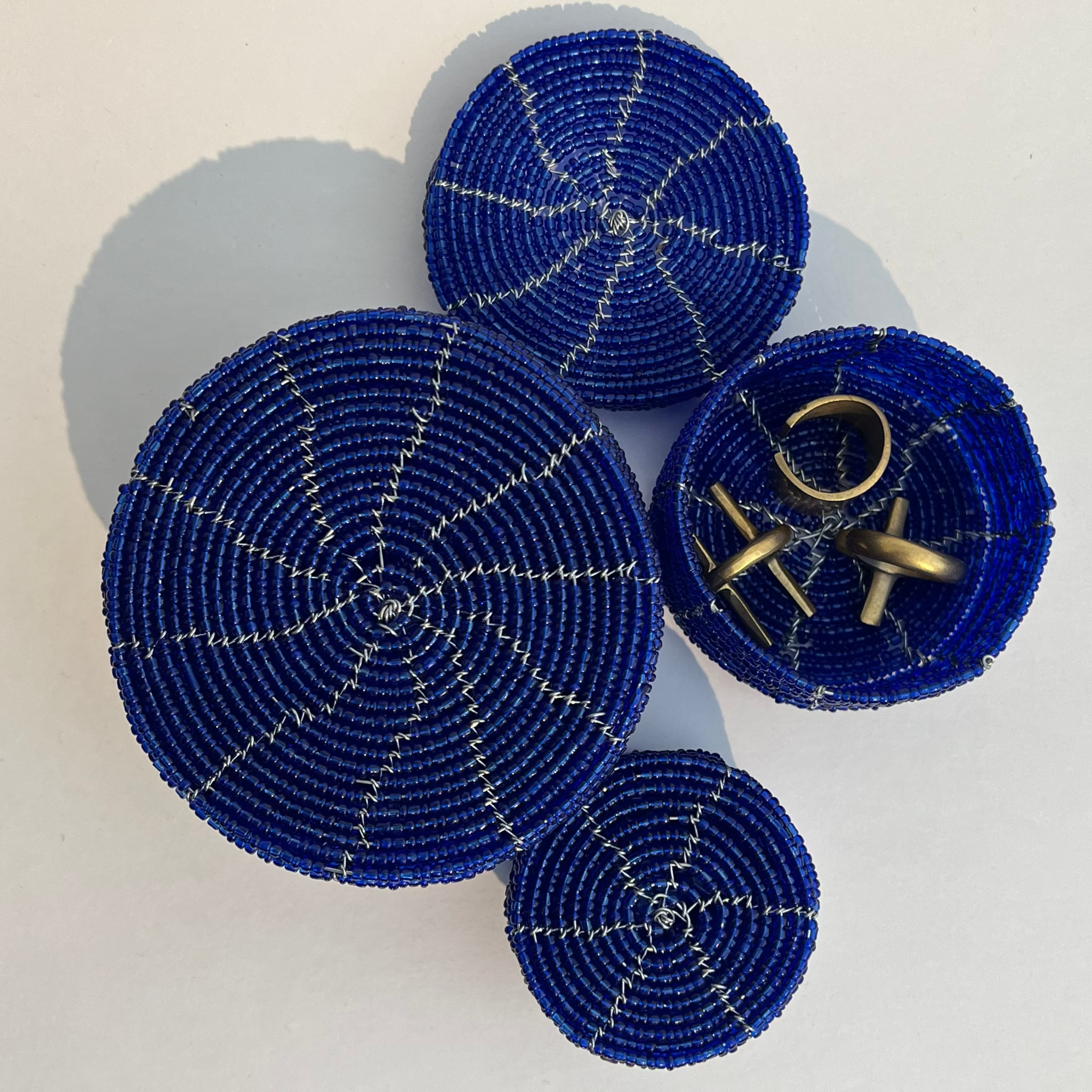 blue beaded round containers with lid with visible wire structure