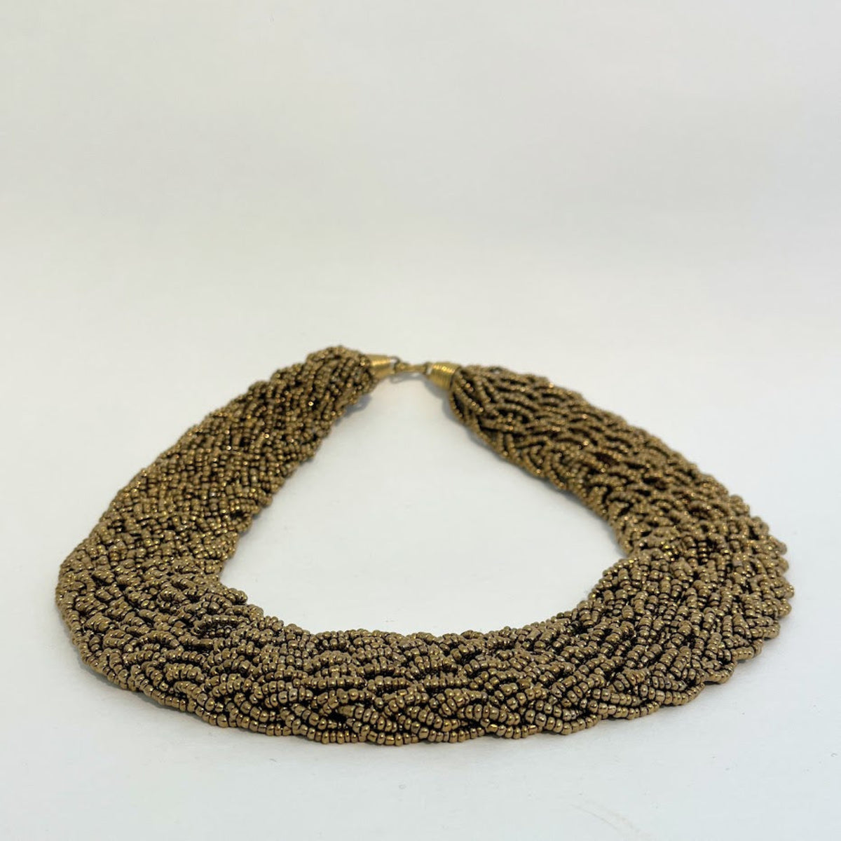 A multi-strand beaded statement necklace in a metallic bronze color, displayed on a clean white background.